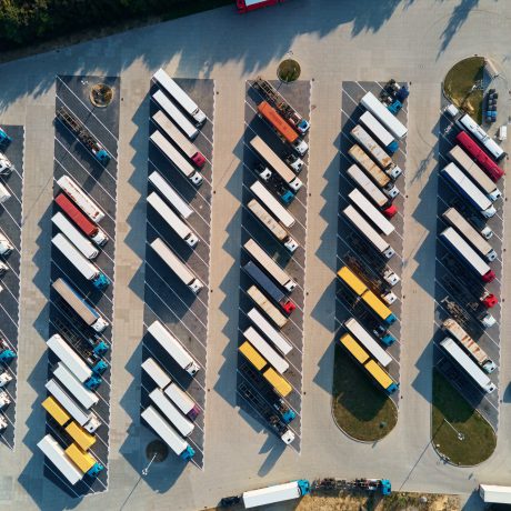 Top view parking lot with parked trucks